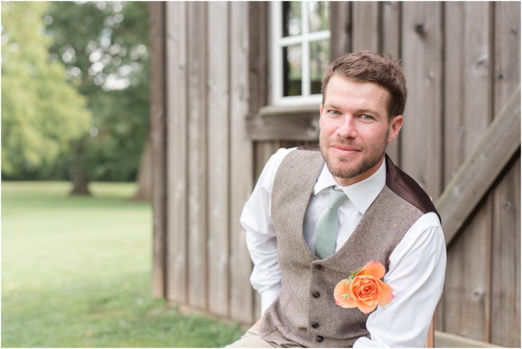 Groom portraits The Barn at Kennedy Farm Wedding with bright, colorful florals and sage green bridesmaids Indiana Wedding Photographer Rose Courts Photography