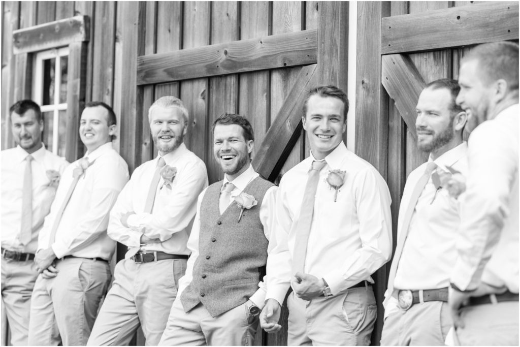 Groomsmens photos The Barn at Kennedy Farm Wedding with bright, colorful florals and sage green bridesmaids Indiana Wedding Photographer Rose Courts Photography