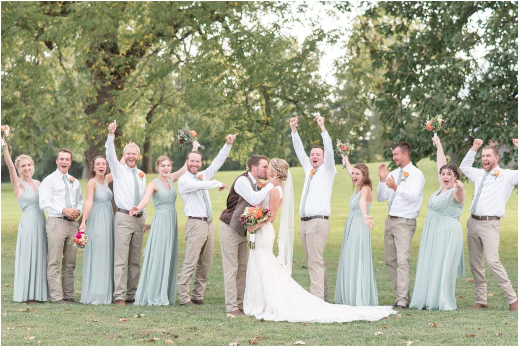 Bride and groom wedding party portraits outdoor ceremony Multi-Colored bridal bouquet The Barn at Kennedy Farm Wedding with bright, colorful bouquets and sage green bridesmaids Indiana Wedding Photographer Rose Courts Photography