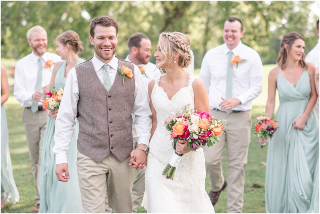 Bride and groom wedding party portraits outdoor ceremony Multi-Colored bridal bouquet The Barn at Kennedy Farm Wedding with bright, colorful bouquets and sage green bridesmaids Indiana Wedding Photographer Rose Courts Photography