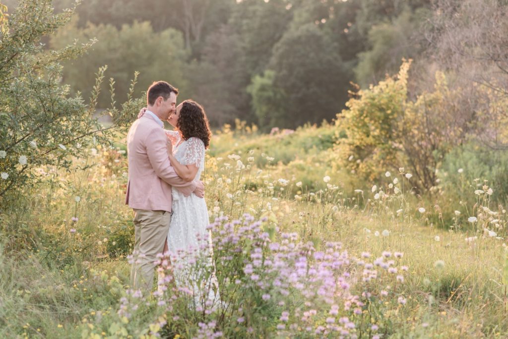 photo of engaged couple at Wildflower Sunset Engagement Session at Metea Park by Courtney Rudicel, a wedding photographer in Indiana