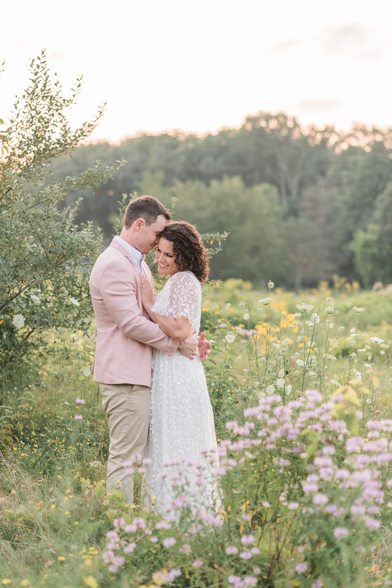 photo of couple in wildflower field  at Metea Park Engagement Session by Courtney Rudicel, a wedding photographer in Indiana