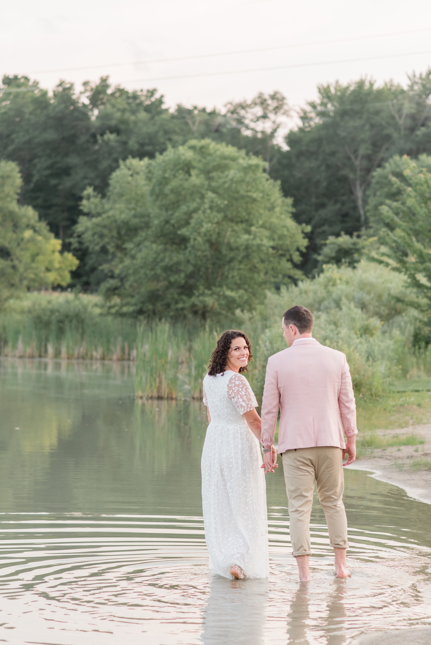 photo of engaged couple in water at Metea Park Engagement Session by Courtney Rudicel, a wedding photographer in Indiana