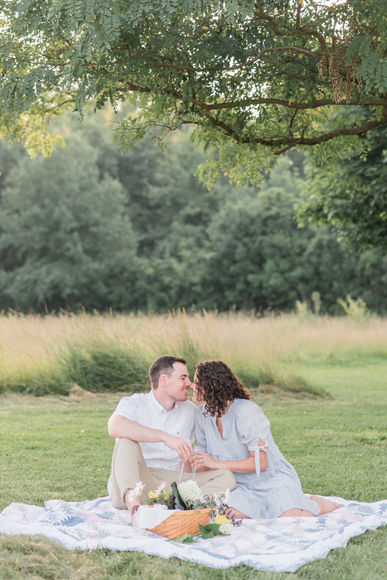 photo of engaged couple at Sunset Picnic Engagement Session at Metea Park by Courtney Rudicel, a wedding photographer in Indiana