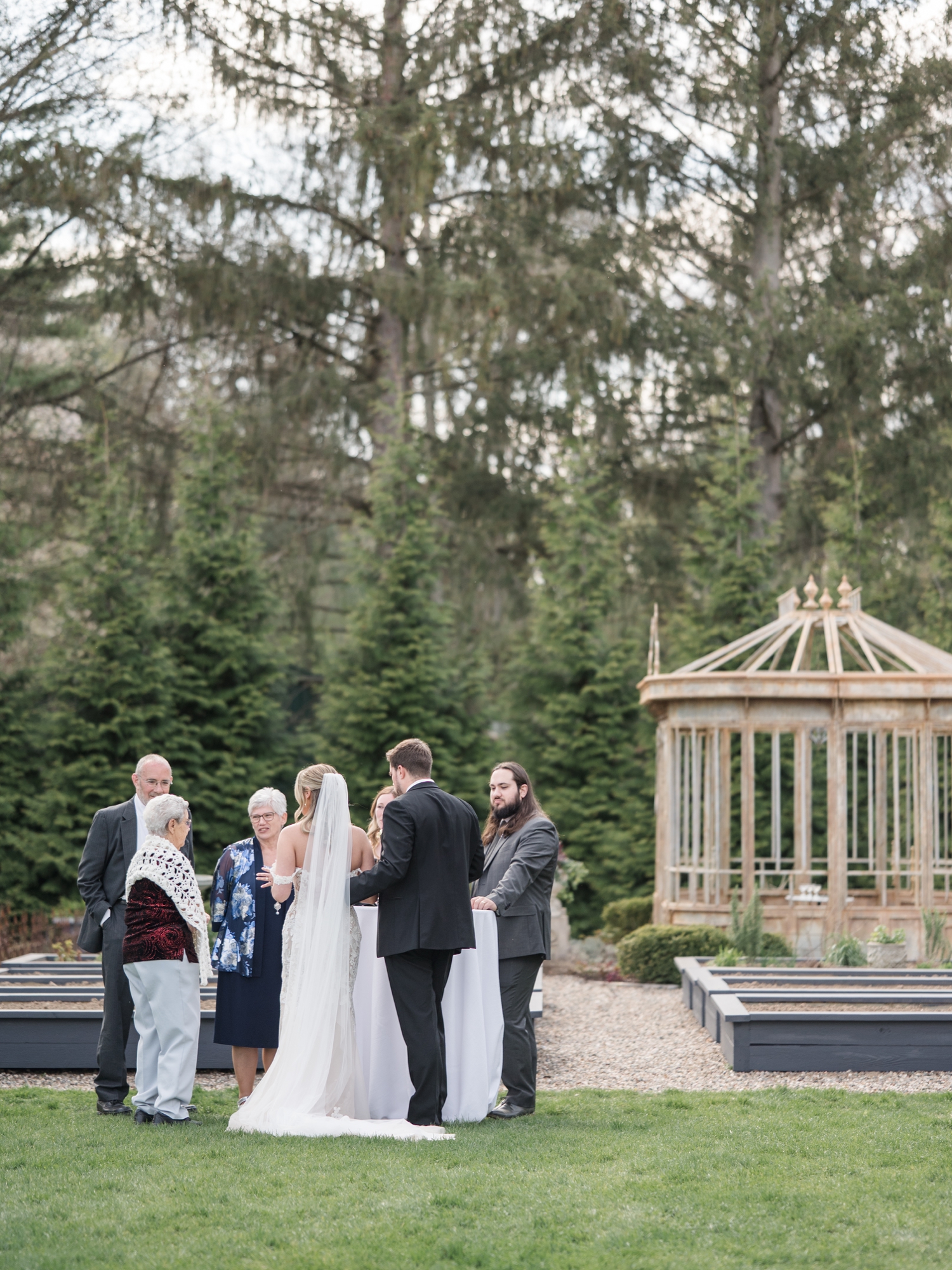 Greencrest Manor mansion cocktail hour in gardens by Michigan Wedding Photographer Courtney Rudicel