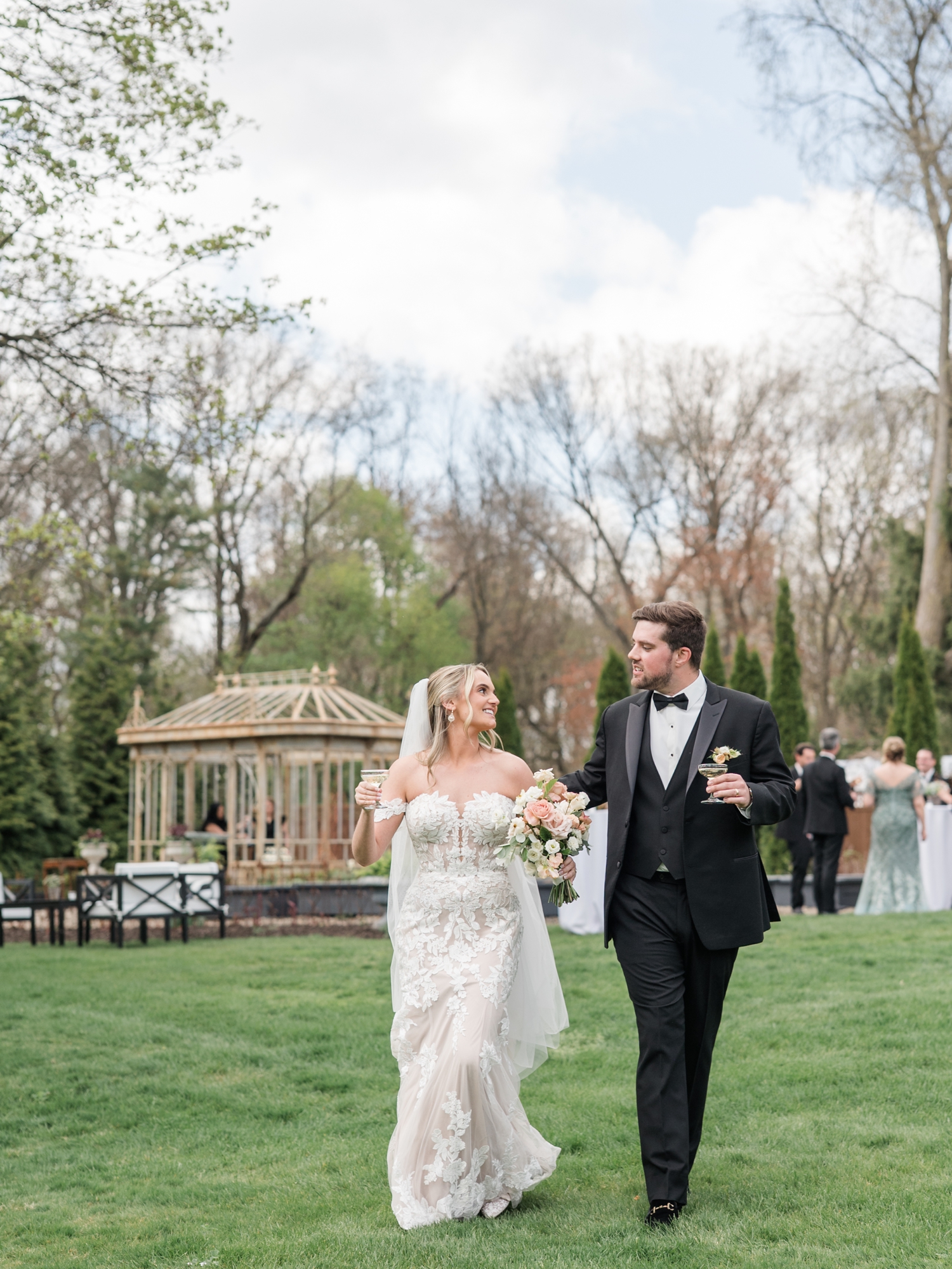 Greencrest Manor mansion cocktail hour in gardens by Michigan Wedding Photographer Courtney Rudicel