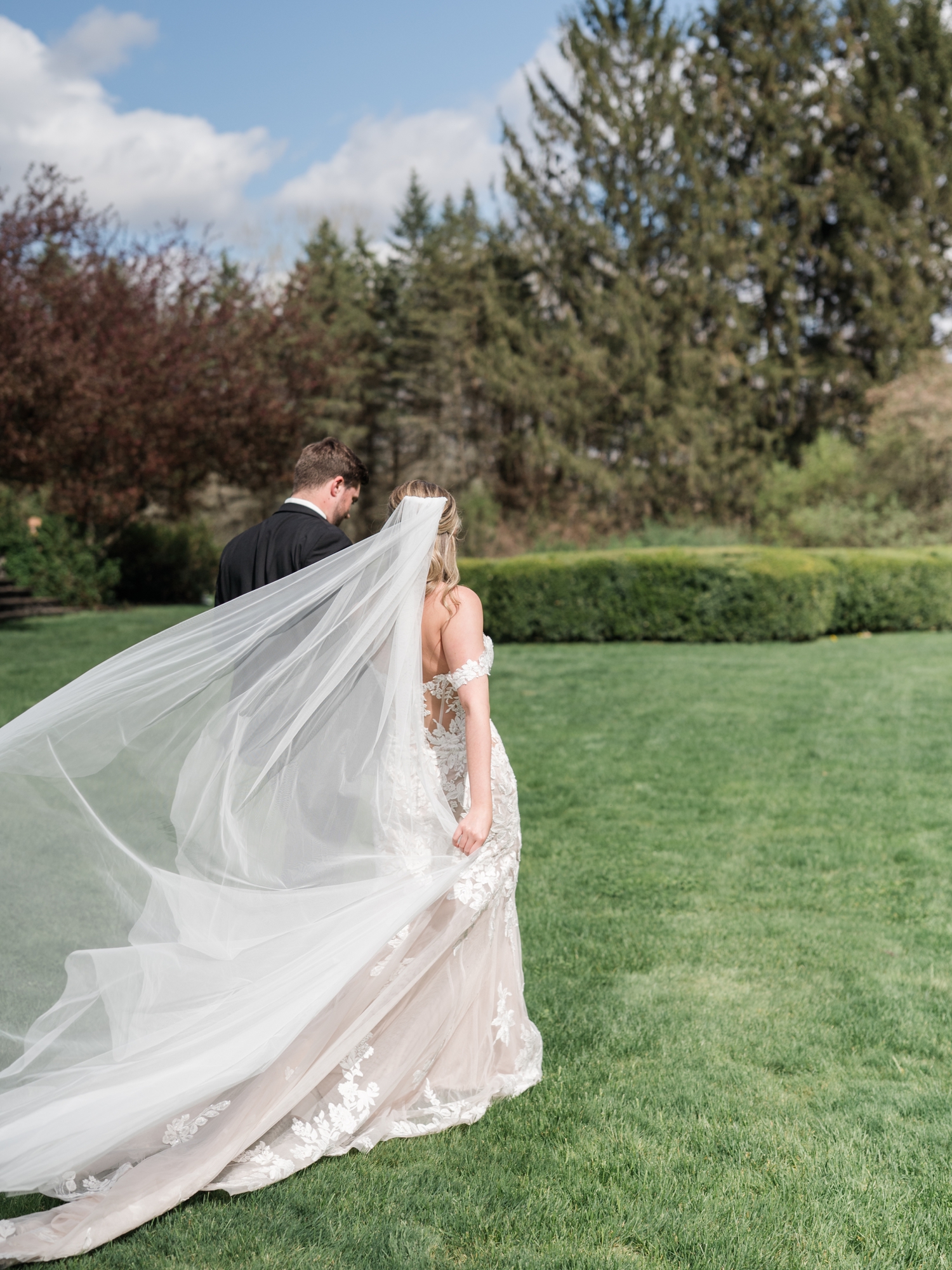 Greencrest Manor mansion cocktail hour in gardens by Michigan Wedding Photographer Courtney Rudicel