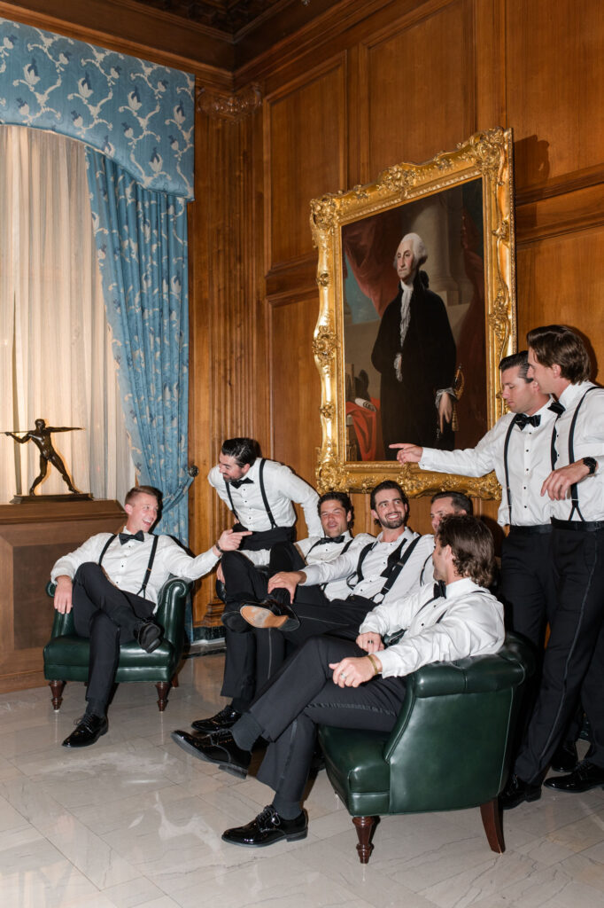 Groomsmen sitting at one of the top detroit area wedding venues