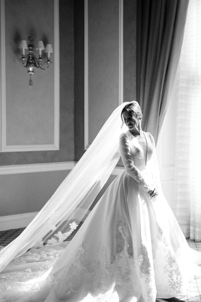 Bride near window at one of the top detroit area wedding venues