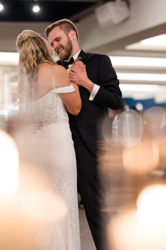 Wedding planning Cincinnati guide featuring bride and groom dancing at the reception. 