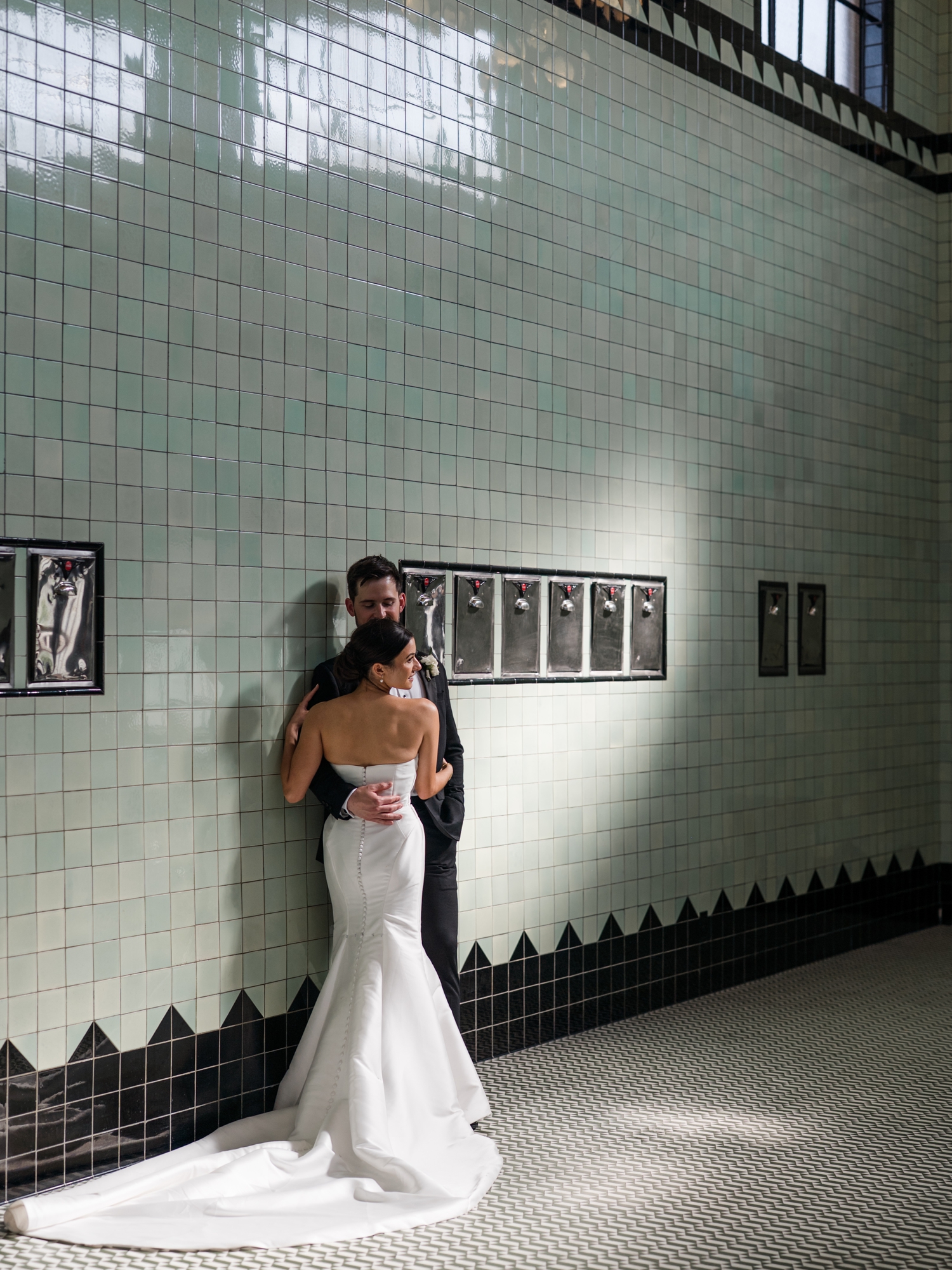 Bride and groom portraits inside Bottleworks Hotel’s historic bottling room.
