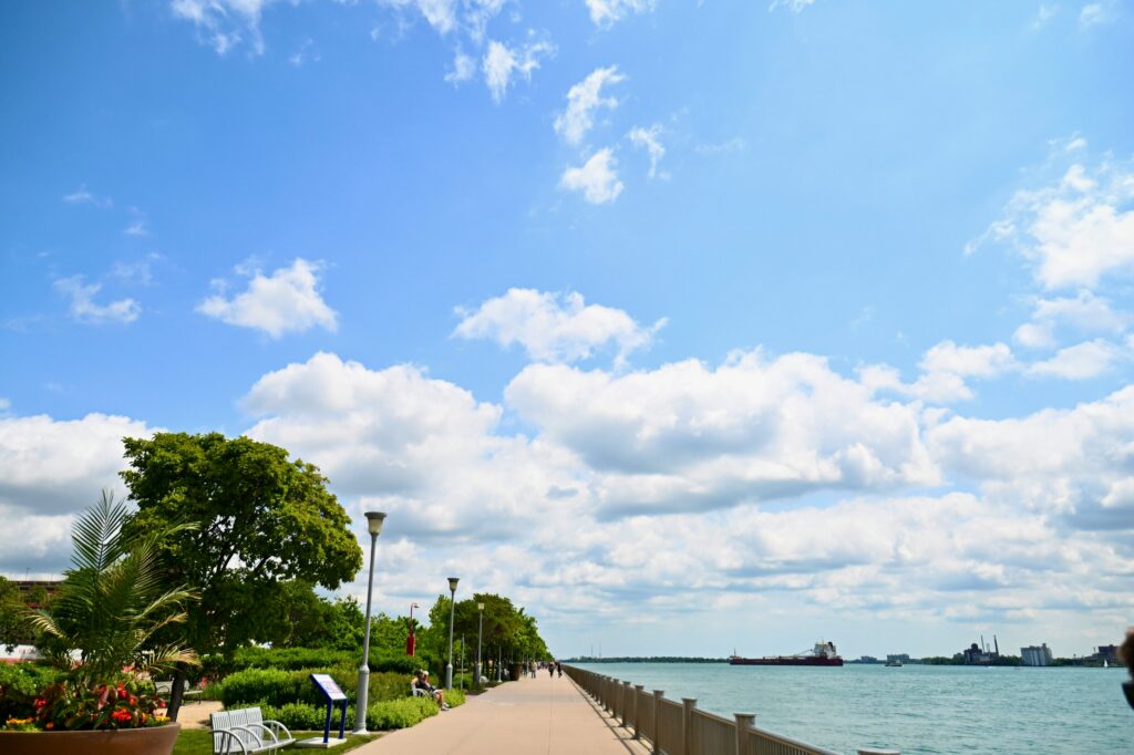 Detroit engagement photo locations with views along the Detroit riverfront. 