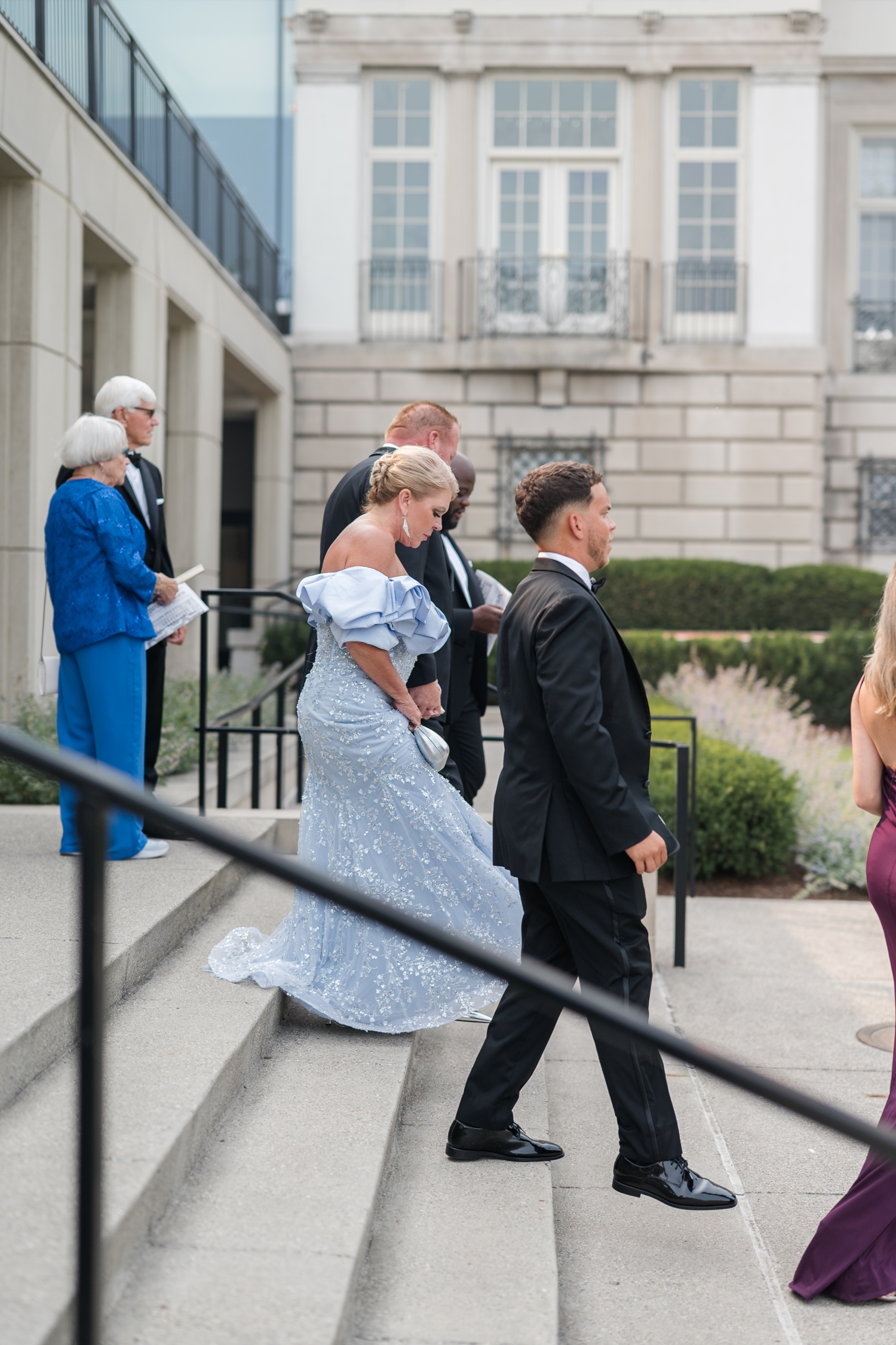black tie guests enter wedding at a Detroit Wedding at The War Memorial 