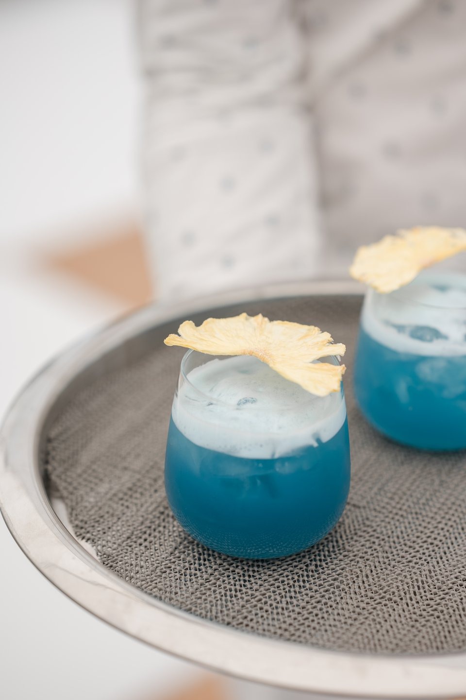 photograph of blue cocktails being served at an outdoor wedding venue in cincinnati