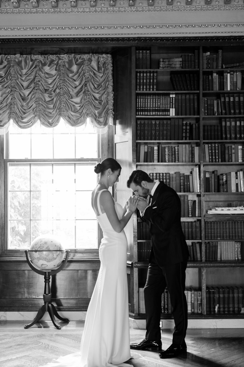 Black and white portrait of Jordan and Maxx together in the Alger House library during their Detroit War Memorial wedding