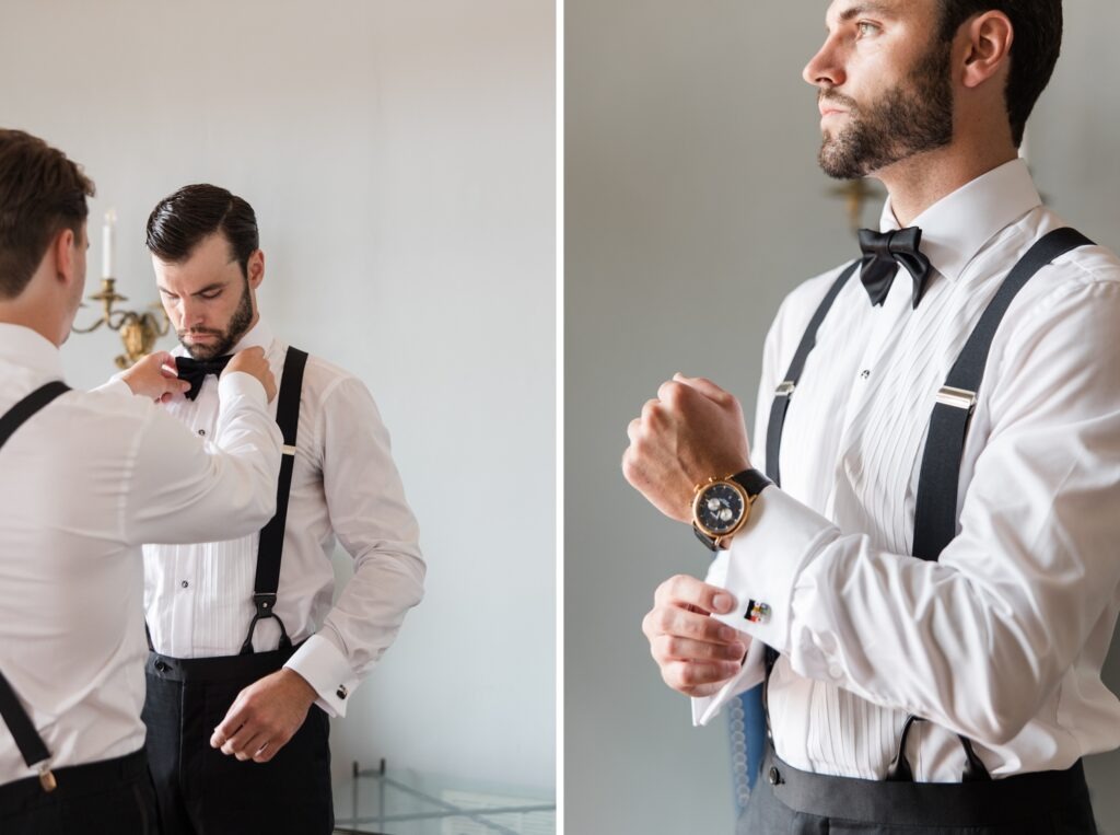 Groom adjusting his cufflinks and bow tie while getting ready in black-tie wedding attire.